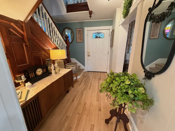 Entry foyer with original wood staircase